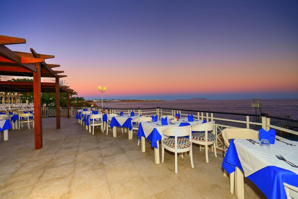 스텔라 디 마레 비치 호텔 앤드 스파 샤름 엘 셰이크 외부 사진 Sunset at the restaurant